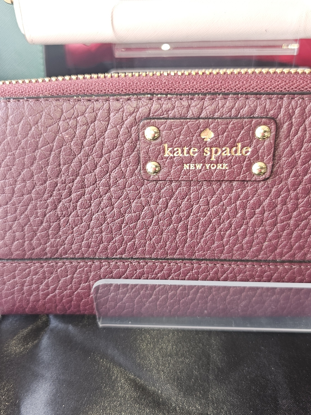 kate spade NY Bay Streetpebbled leather zip wallet - wine